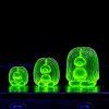 uranium glass troll family figurines glowing green under UV light