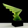 Side view of Art Deco lightning hood ornament in uranium glass mounted on black glass base