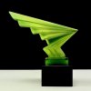 Art Deco lightning hood ornament made of uranium glass on black glass base with strong UV glow