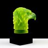 Side view of Art Deco eagle head hood ornament in uranium glass mounted on black glass base