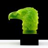 Back view of Art Deco uranium glass eagle head hood ornament with sculptural feather relief and black base