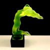 Side view of Art Deco nude female hood ornament uranium glass with black glass base