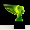 Art Deco pharaoh head hood ornament made from uranium glass, mounted on black glass base