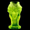 uranium glass nymphs vase glowing under uv light, high relief