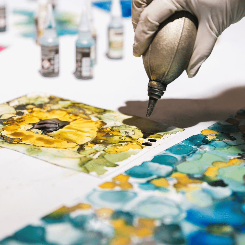 Creating abstract paintings using alcohol ink and sparkling pigments