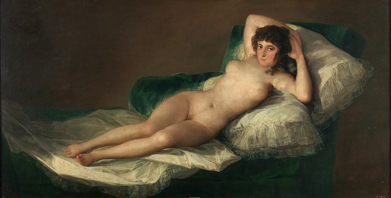Nahá Maja od Francisca Goyi, kolem 1797–1800 – nahá žena leží na zelené pohovce s rukama za hlavou