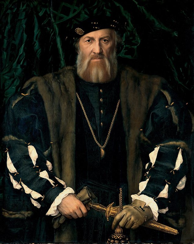 Charles de Solier, pán z Morette od Hanse Holbeina mladšího – vousatý muž v černém oděvu s dýkou na zeleném pozadí