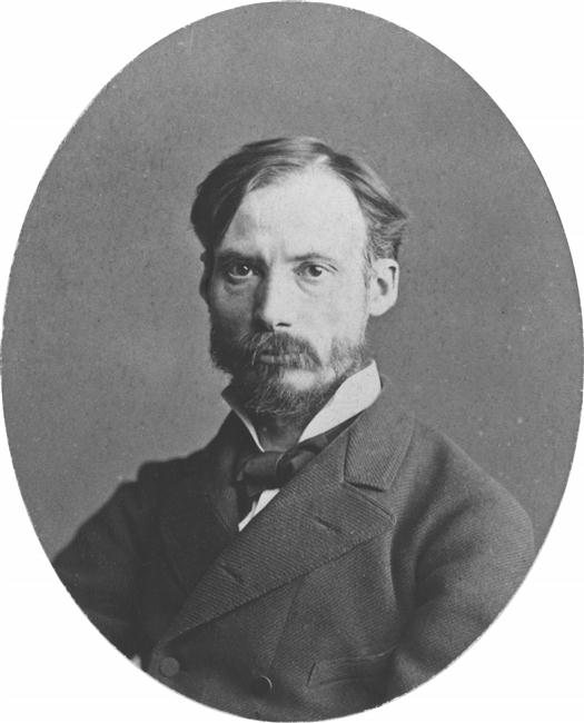 Pierre-Auguste Renoir kolem roku 1875 – černobílá oválná fotografie muže s krátkými vousy a knírem v tmavém saku