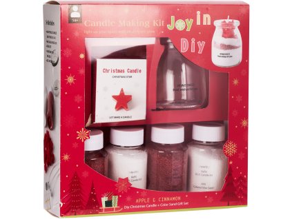 28229 1 sada pro vyrobu svicek candle making kit v cervene vanocni krabici uvnitr je sklenena nadoba baleni malych cervenych hvezdicek na dekoraci a ctyri lahvicky s voskovymi casticemi cervene a bile vune apple cinnamon