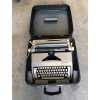 psací stroj kufr