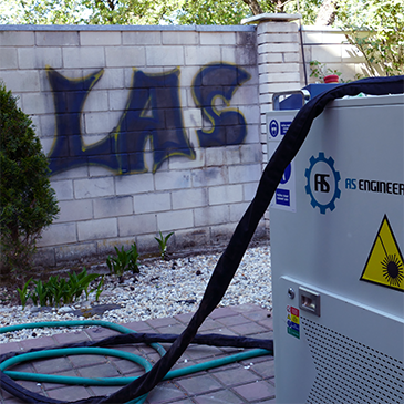 Čistenie laserom graffitov na stenách, plotoch a iných plochách