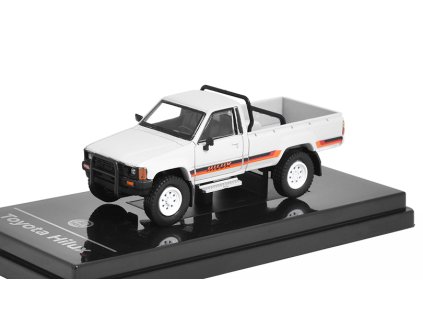 Toyota Hilux Pick-up 1984 bílá RHD Pravostranné Řízení 1:64 - PARAGON Models  Toyota Hilux PickUp LHD 1984 1/64 - kovový model auta 1/64
