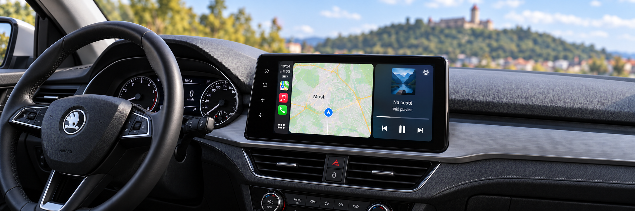 CarPlay s navigací Most a rozmazaným hradem Hněvín v pozadí – ilustrační zobrazení