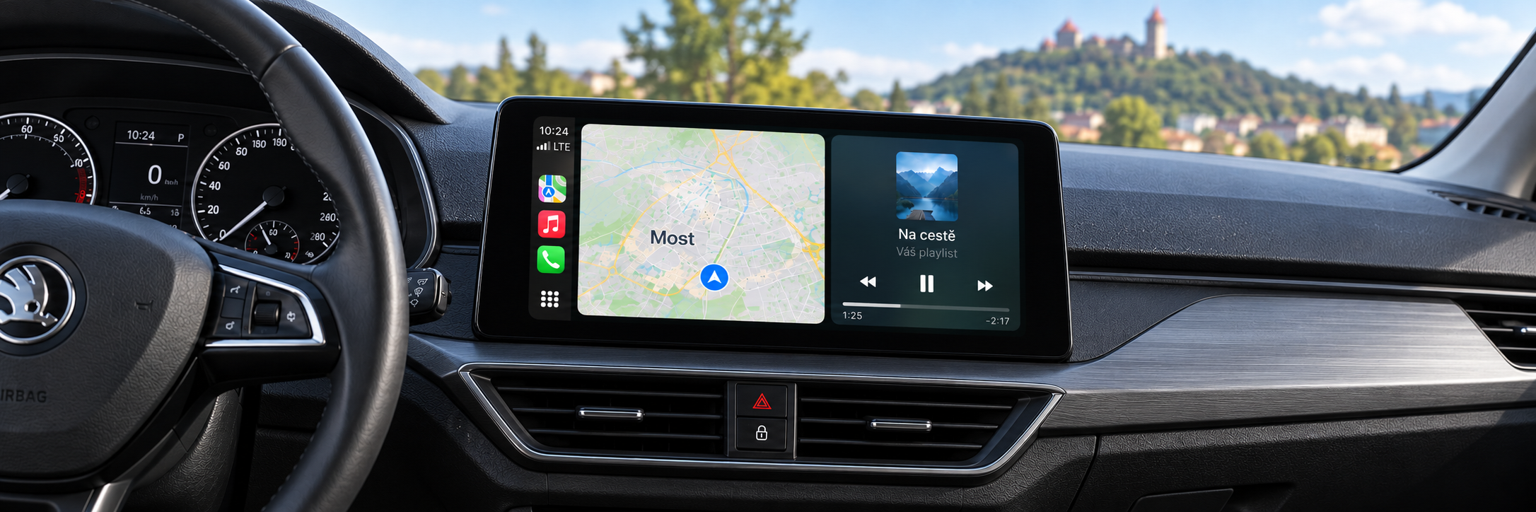 CarPlay s navigací Most a rozmazaným hradem Hněvín v pozadí – ilustrační zobrazení