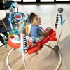 BABY EINSTEIN Skákadlo/aktívne centrum 2v1 Ocean Explorers Airplane Adventure™ 6m+ do 12 kg