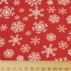 Bavlna vzorovaná - Vianoce Biele vločky na červenom
