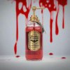Tekuté mýdlo Krev Draculy 490 ml na pozadí s červenými cákanci