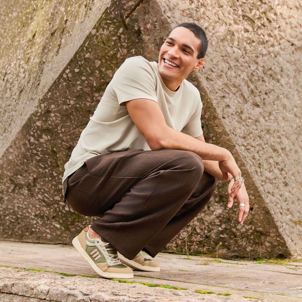Man wearing green barefoot sneakers in the city
