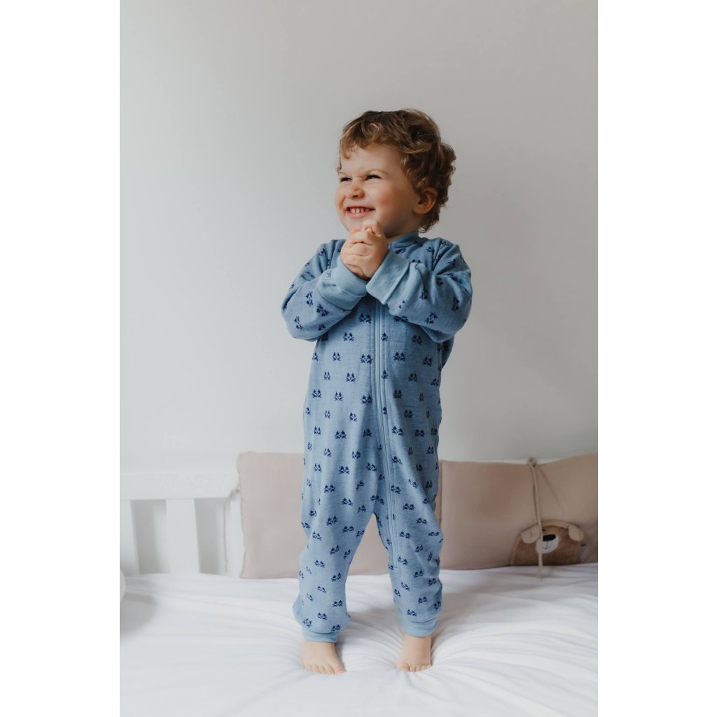 Spokojené dítě v pyžamu/overalu z merino vlny