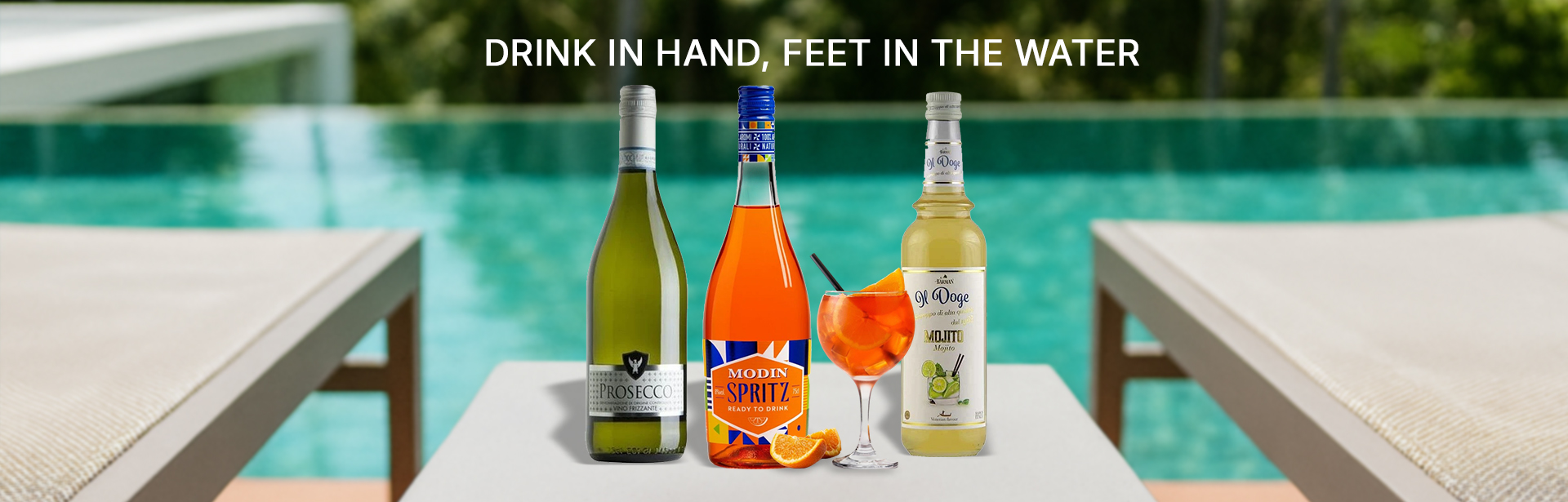 Drink in hand, feet in the water