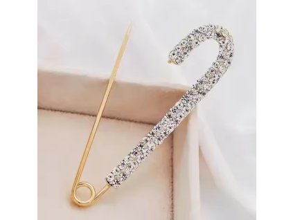 Pozlacená brož ve tvaru spínacího špendlíku s krystaly