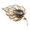 Brož ve zlaté barvě s velkým tmavým krystalem 9 cm