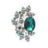 Postříbřená brož s velkým zeleným krystalem a větvičkovými lístky