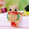 Designová zlatá klíčenka Sova s krystaly a barevným smaltem