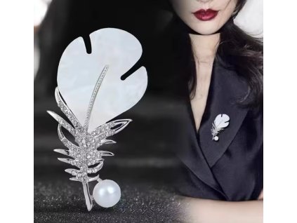 Pozlacená brož ve tvaru pírka s krystaly