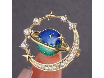 Pozlacená brož ve tvaru planety s krystaly