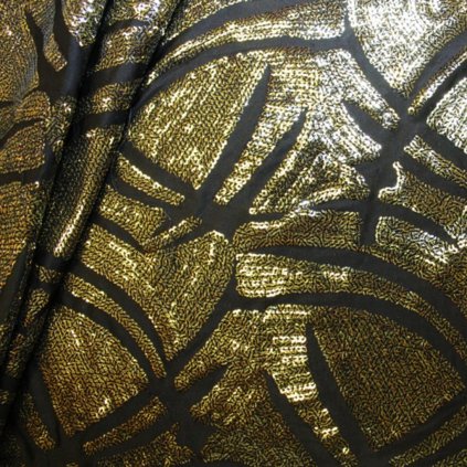 Flitry zlaté na černém podkladě