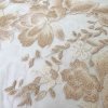 Smetanová krajka vyšívana na tylu se smetanovo-zlatým květinovým vzorem
