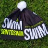Winter cap BornToSwim® black with yellow logo and white pompom