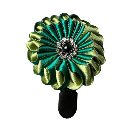 Satin brooch with a black metal sun button
