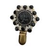 Brooch with Black Floral Motif