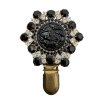 Brooch with Black Floral Motif