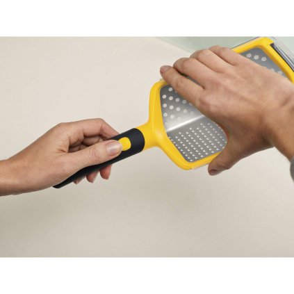 Struhadlo s flexibilní rukojetí oranžové Twist Grater™ Joseph Joseph