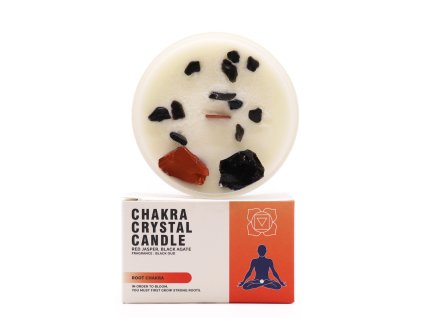 svíčka kořenová čakra položená na dárkové krabičce