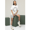 oversized tee mockup featuring a woman sitting on a cube m26155
