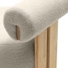 Béžové designové křeslo s měkkým sedákem a válcovou opěrkou