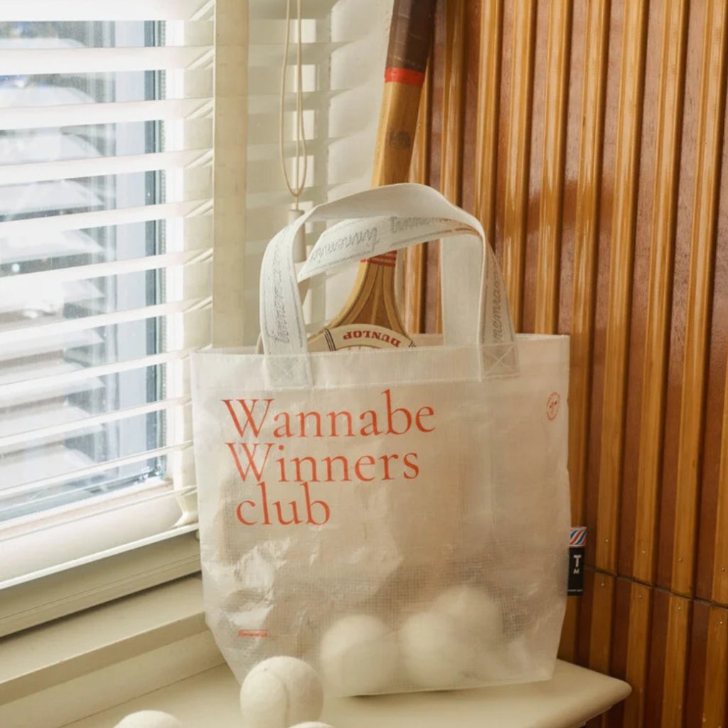 Perfect for your bathing suit, tennisballs, or (dirty) sport clothes, or for shopping of course! This baggy is part of our sports collection. Printed with a motivational quote.  Add to cart Quantity: 1   Add to comparison Add to wishlist Delivery time: 1 till 3 workdays  Description This sports bag is a new addition! It was designed as part of our sports collection. It comes with beautiful sporty handles that have our name tinnemia woven into them. This bag is transparant en is printed with a quote: 'Wannabe Winners club'. Inside, there are some handy pockets for your keys or phone.  specifications - size bag: 38 x 29 cm - material: PP transparant - quote: Wannabe Winners club