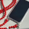 LE STUDIO Korálkový popruh na telefon dlouhý - červený