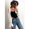 Čierno-biely crop-top s puff rukávmi