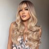 Extravagantní hustá a vlnitá zlatá blond paruka Katie