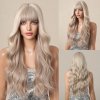 Dlouhá platinová blond paruka Elara s vlnami a ofinou