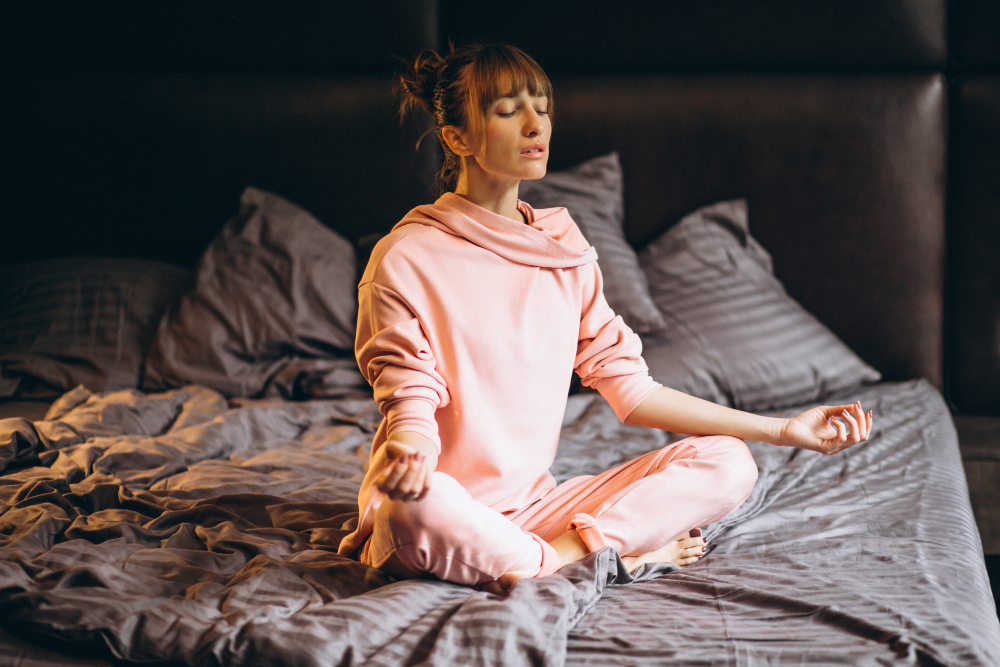 woman-doing-yoga-bed