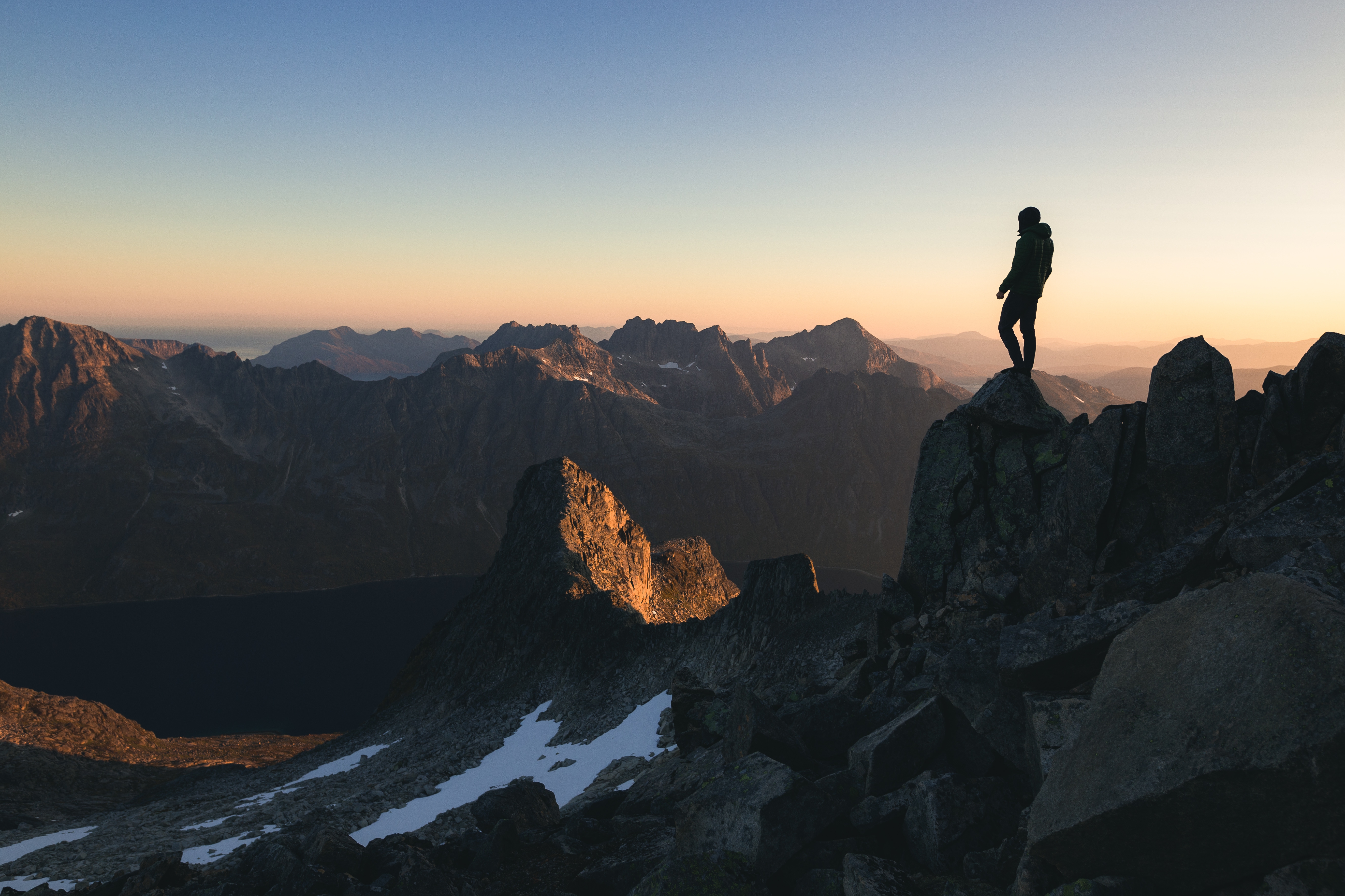 silhouette-person-standing-top-hill-beautiful-colorful-sky-morning