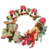 Adventní věnec s červenými svíčkami a mašlí  Adventní věnec