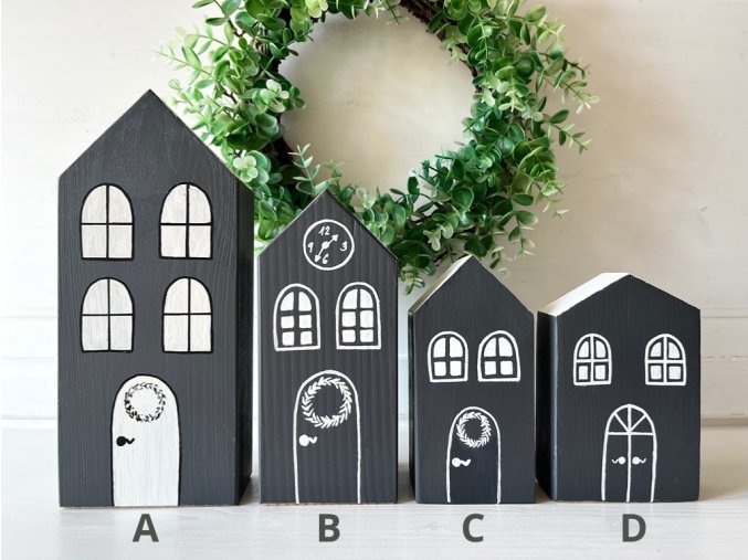 Dřevěné tmavě šedé domečky s bílou střechou