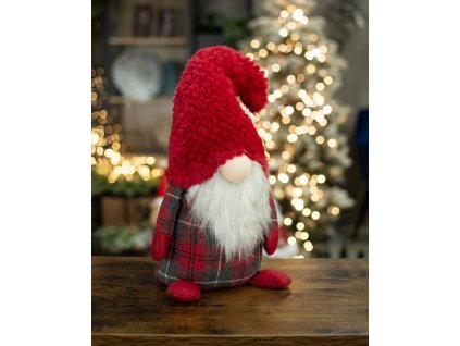 Karácsonyi manó egy piros sapkás fiúval